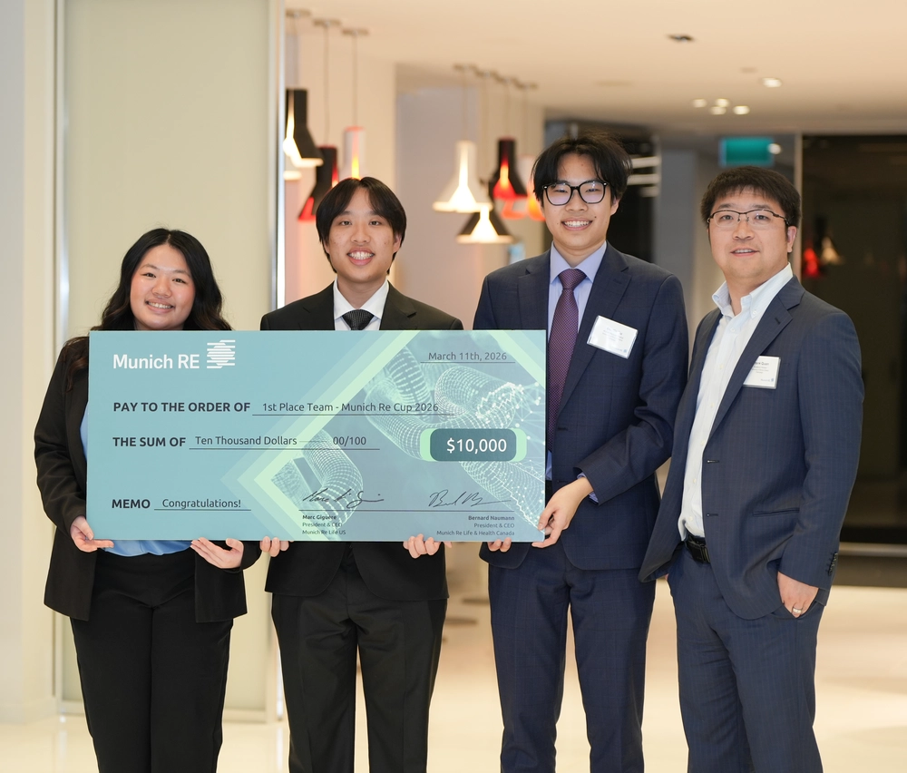 brina Hsieh, Destin Yu, Peter Zhang, and Dr. Frank Quan pose with their Munch Re Cup Prize.