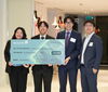 Destin Yu, Peter Zhang, Sabrina Hsieh, and Dr. Frank Quan pose with their Munch Re Cup Prize.